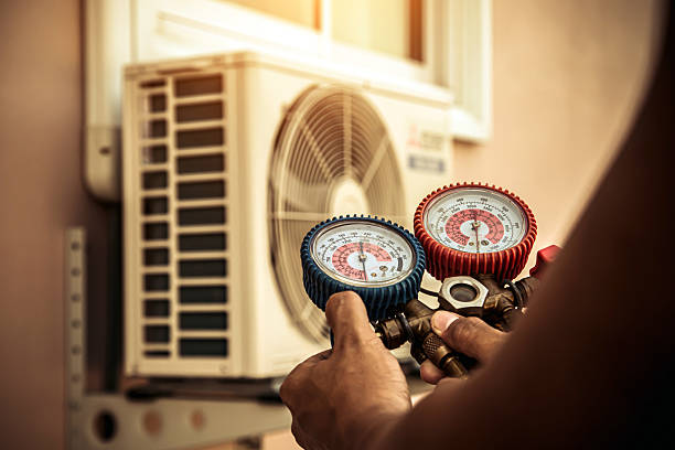 Professional Air Conditioning Service technician working in Altamont, IL